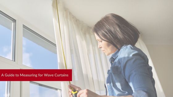 Woman measuring a window for her curtains